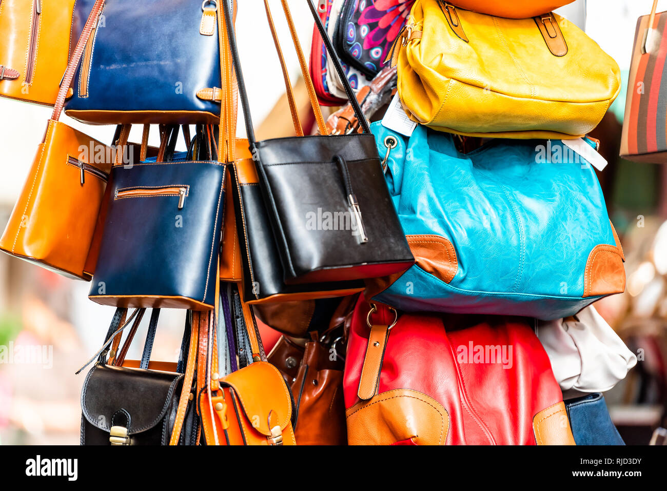 Rome, Italy Many leather purse bags colorful vibrant colors hanging on