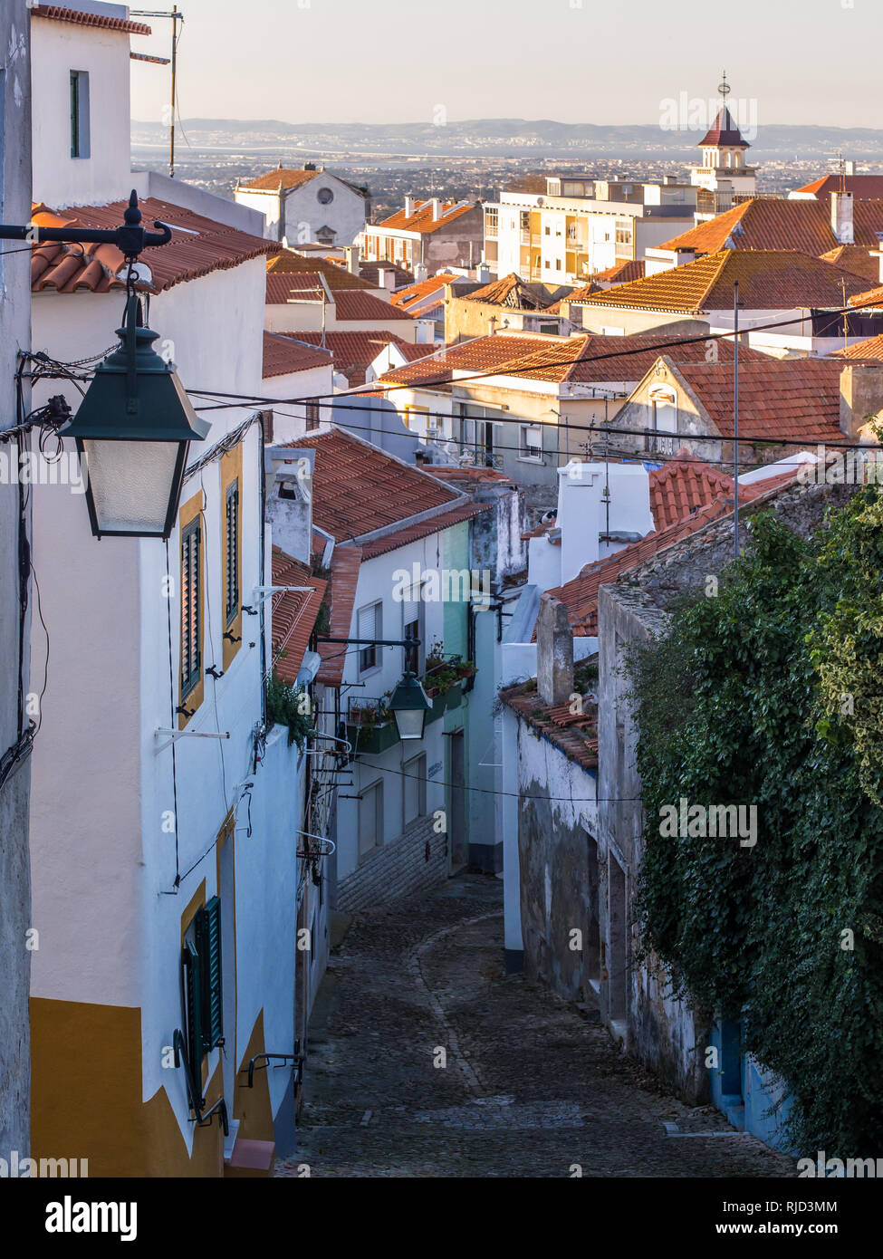 Street in the Old Town in Palmela, Setubal District, south of Lisbon in Portugal, at sunset. Stock Photo