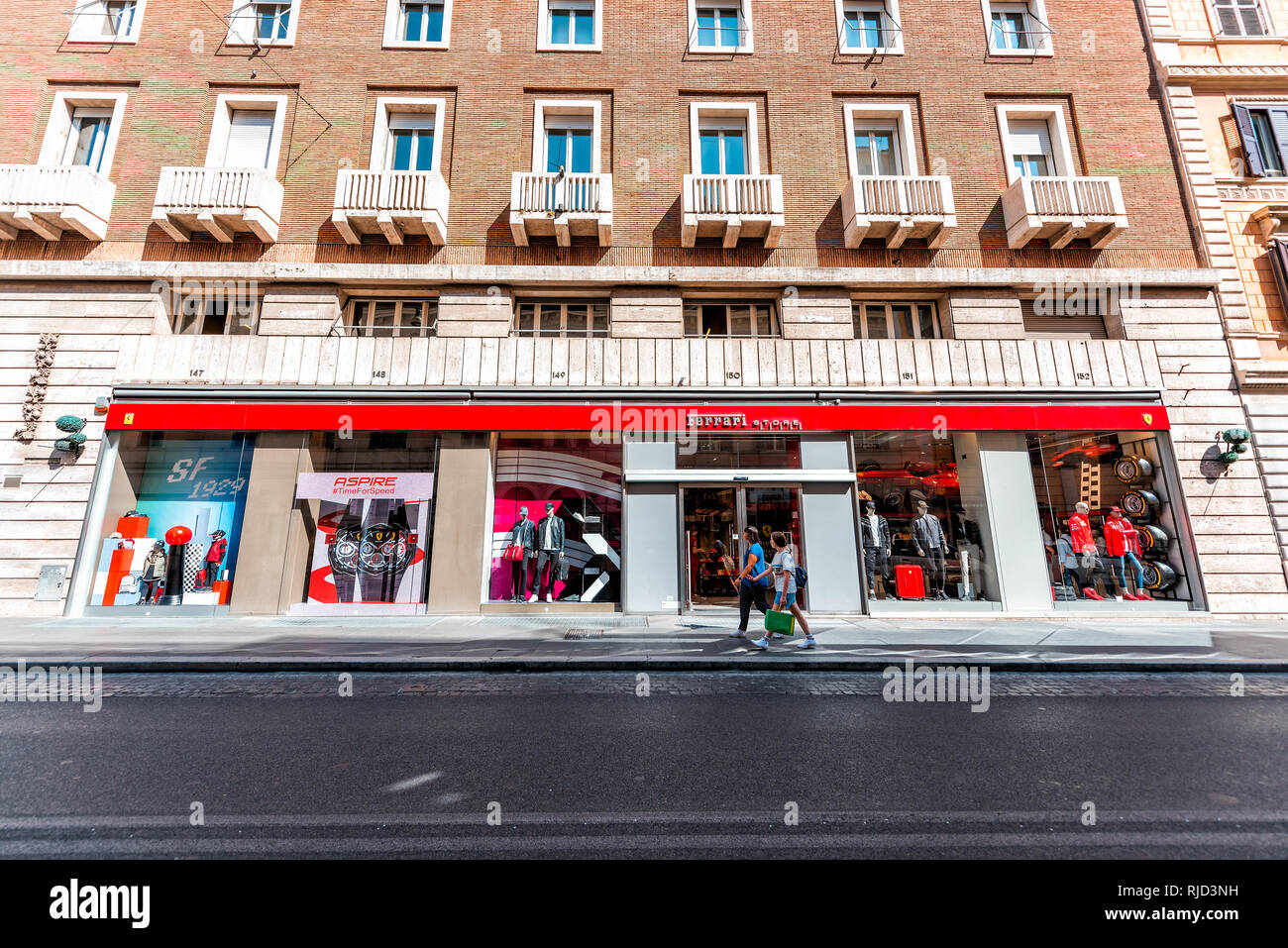 Rome, Italy - September 5, 2018: Italian street outside in historic city sunny day storefront for Ferrari store Stock Photo