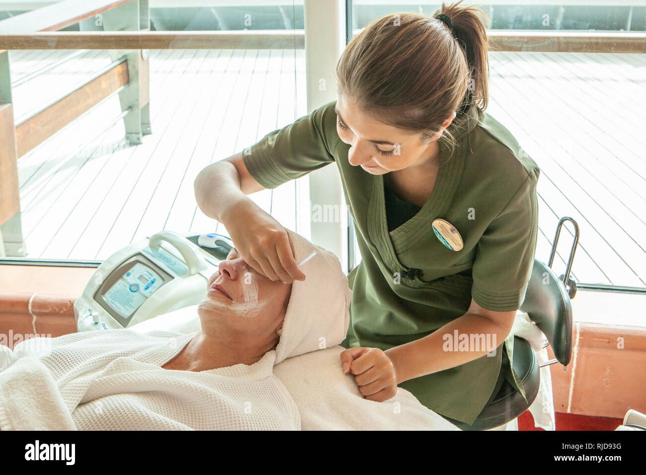 Attractive mature woman having beauty treatments in a salon on board a cruise ship Stock Photo