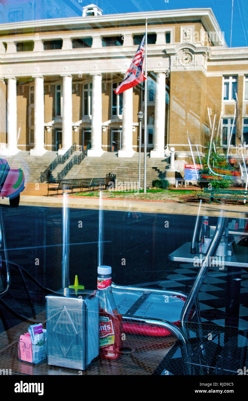 The Alcorn County Courthouse is reflected in the window of Borroum's Drug Store on Waldron Street in Corinth, Mississippi, Feb. 26, 2012. Stock Photo