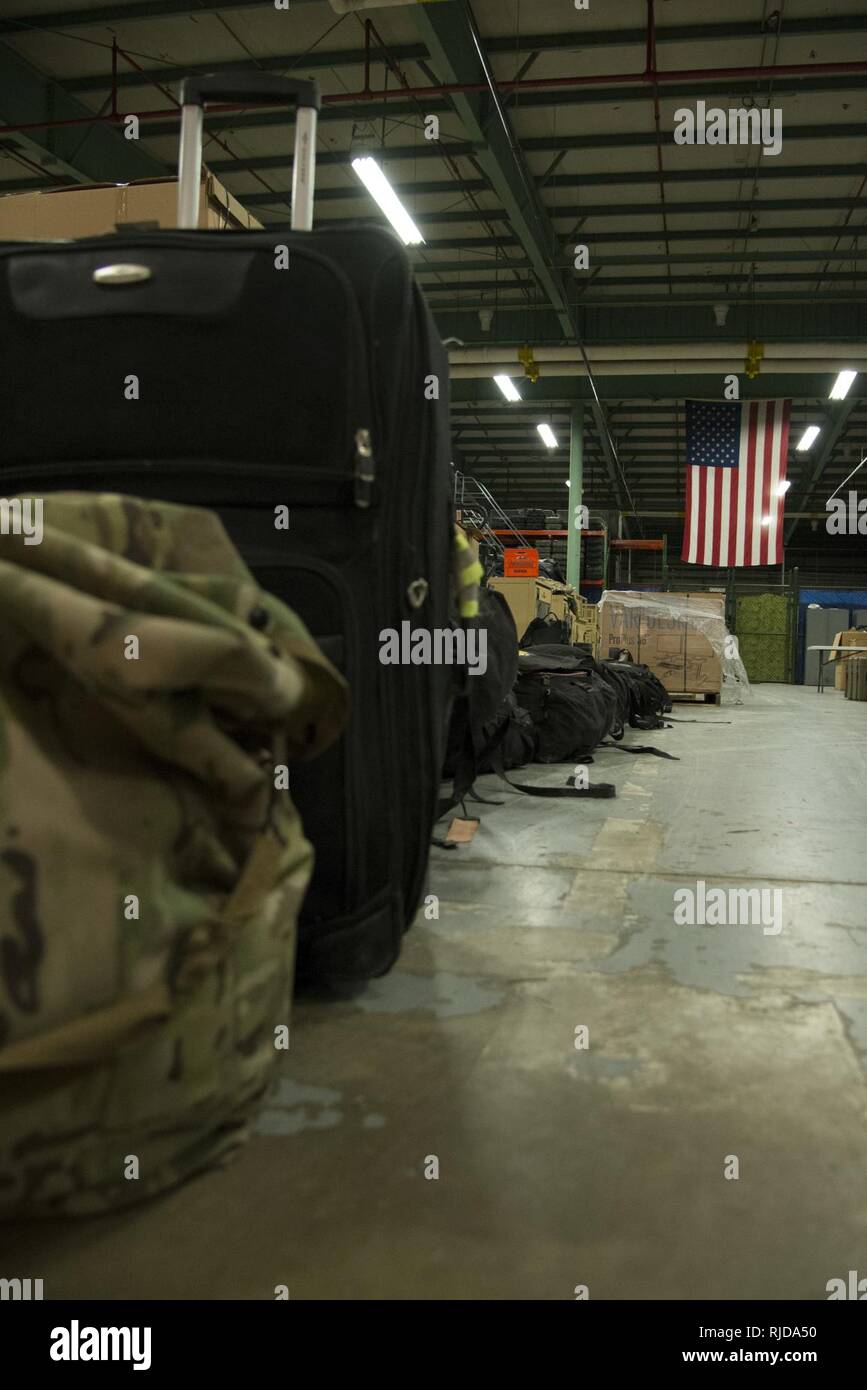 Luggage belonging to 12 returning 436th Security Forces Squadron defenders rests in a warehouse after a six-month deployment to the Middle East, Jan. 21, 2018, at Dover Air Force Base, Del. Families and unit members met the defenders upon their return. Stock Photo