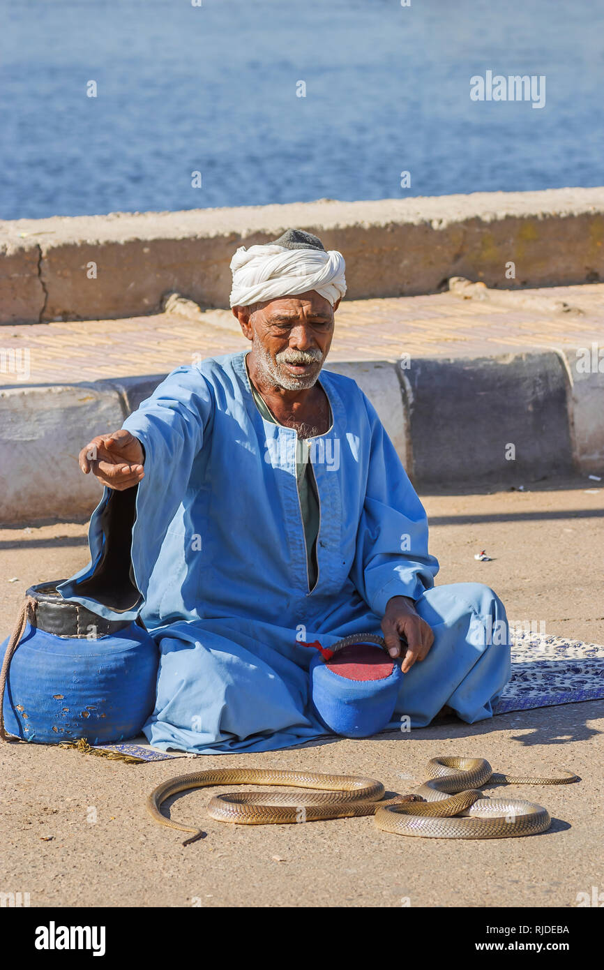 Snake charmer with cobras at the Temple of Kom Ombo, Temple of Sobek