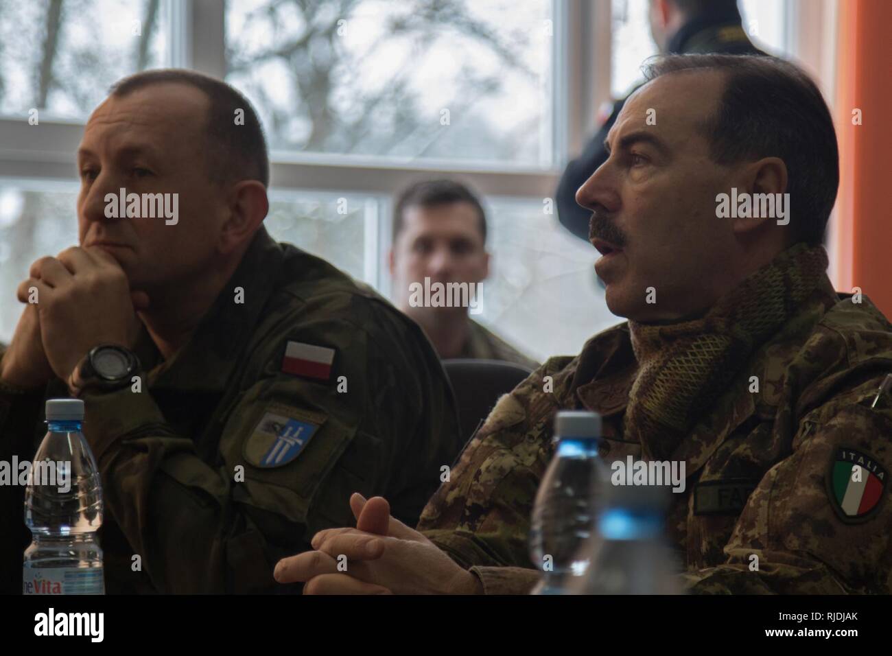 The commander of NATO Allied Joint Force Command Brunssum, Italian army  Gen. Salvatore Farina, is briefed by the Battle Group Poland commander  while visiting the battle group at the Bemowo Piskie Training