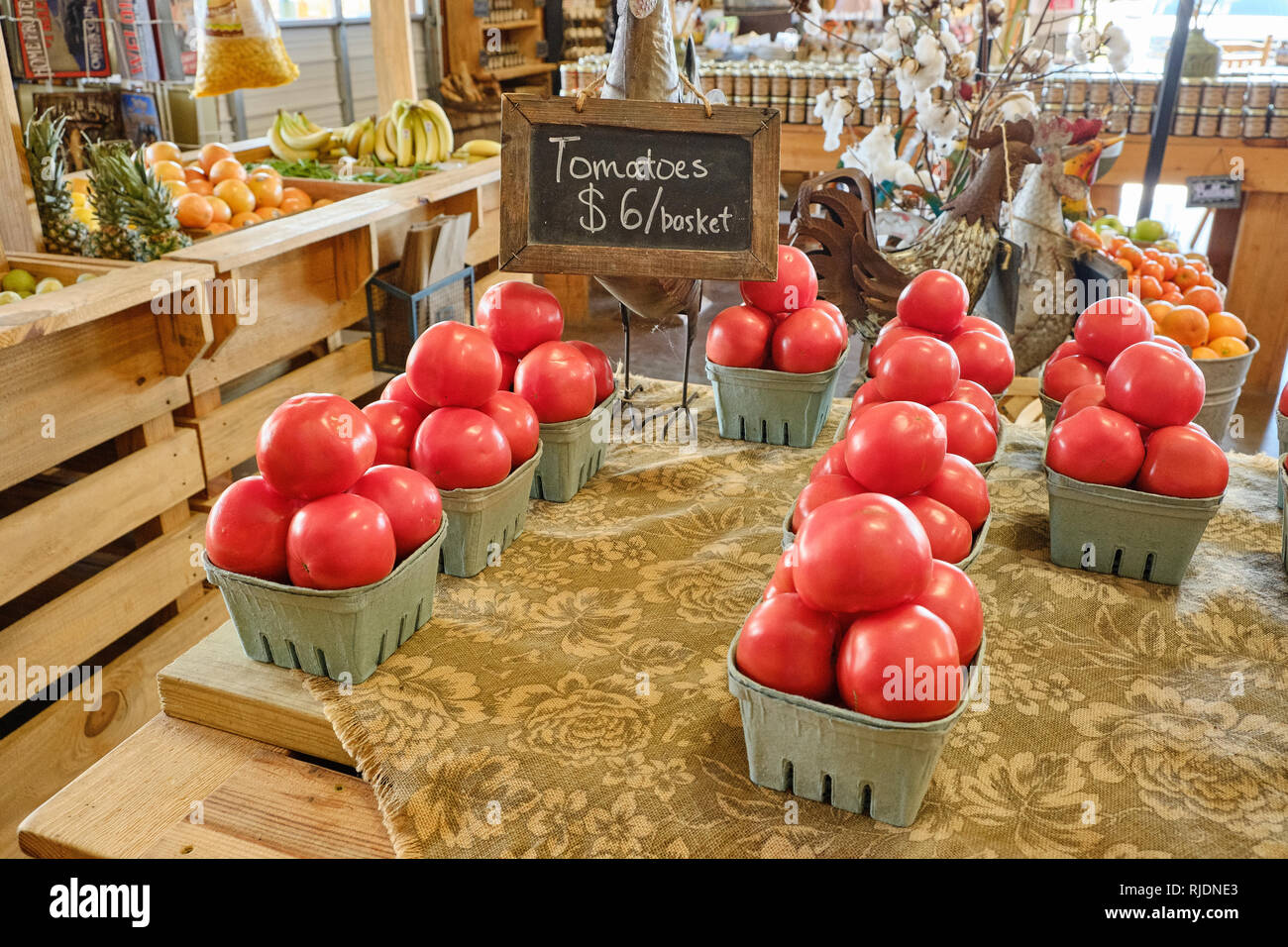 Farm fresh beefsteak tomatoes on display for sale in a rural Alabama farmer's market or roadside market in Pike Road Alabama, USA. Stock Photo