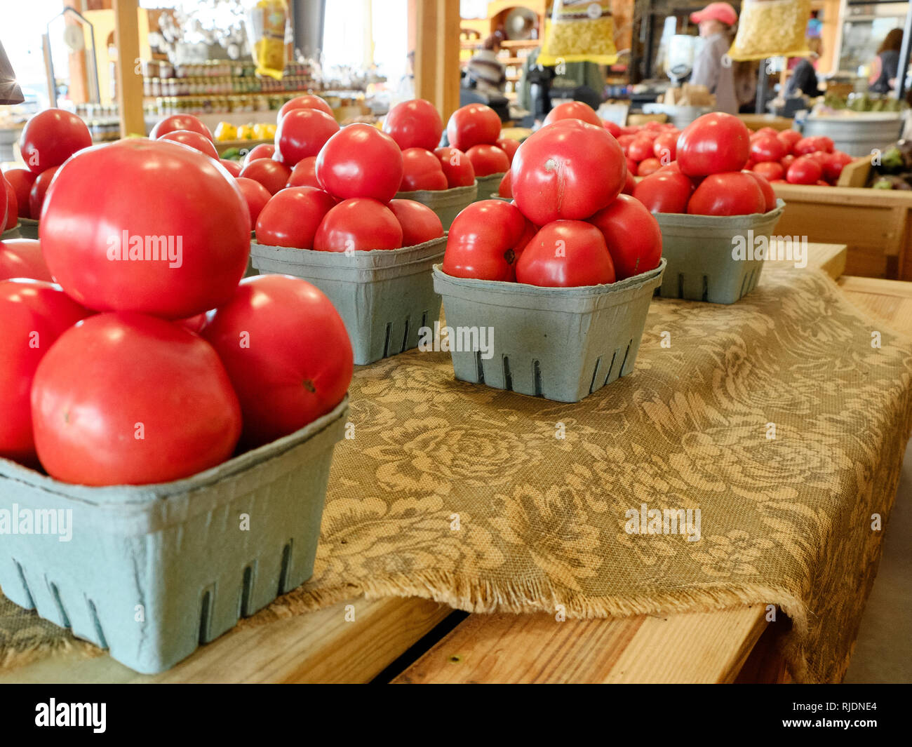 Farm fresh beefsteak tomatoes on display for sale in a rural Alabama farmer's market or roadside market in Pike Road Alabama, USA. Stock Photo