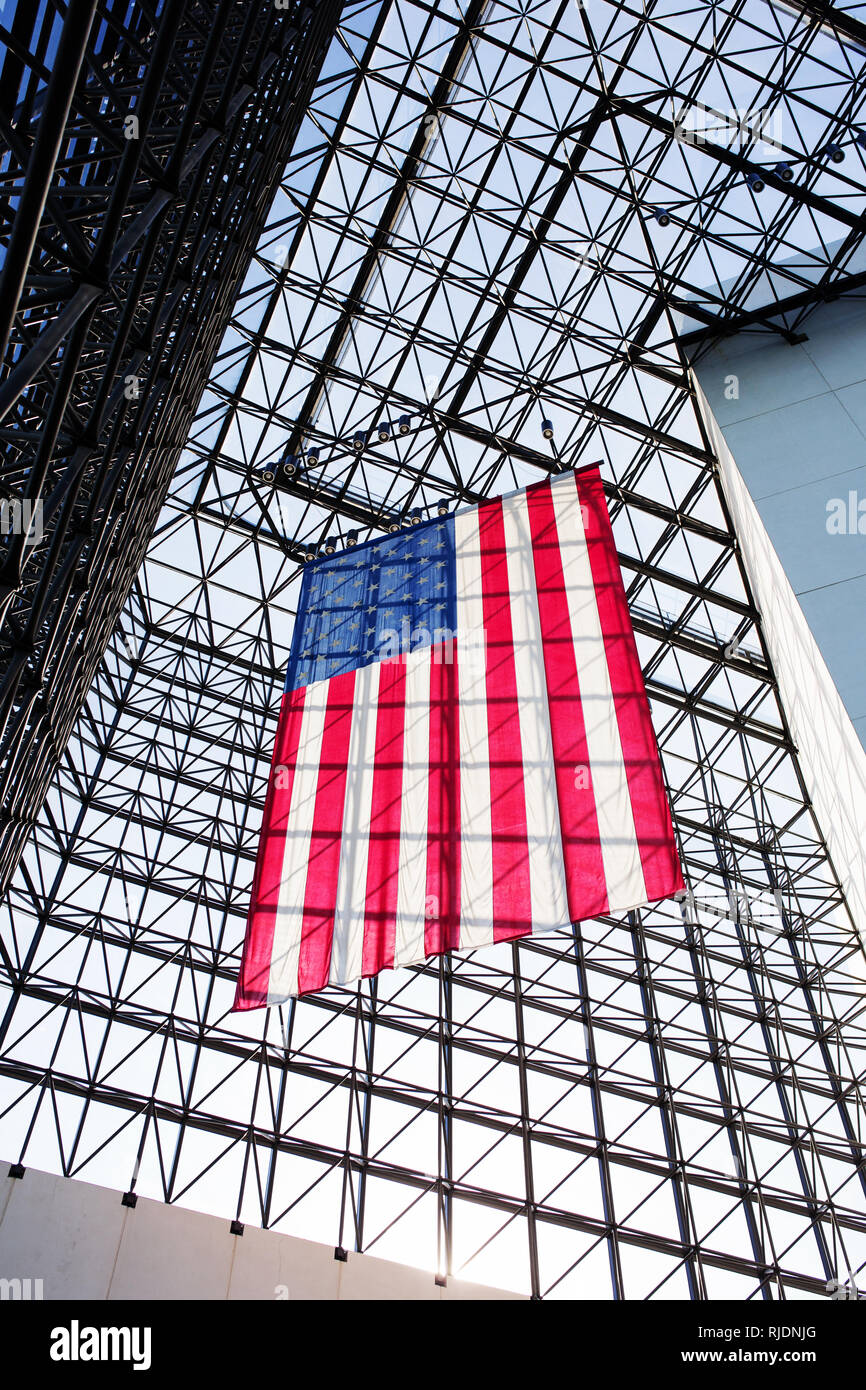An American flag hangs inside the John F. Kennedy Presidential Library and Museum in Boston, Massachusetts, USA. Stock Photo