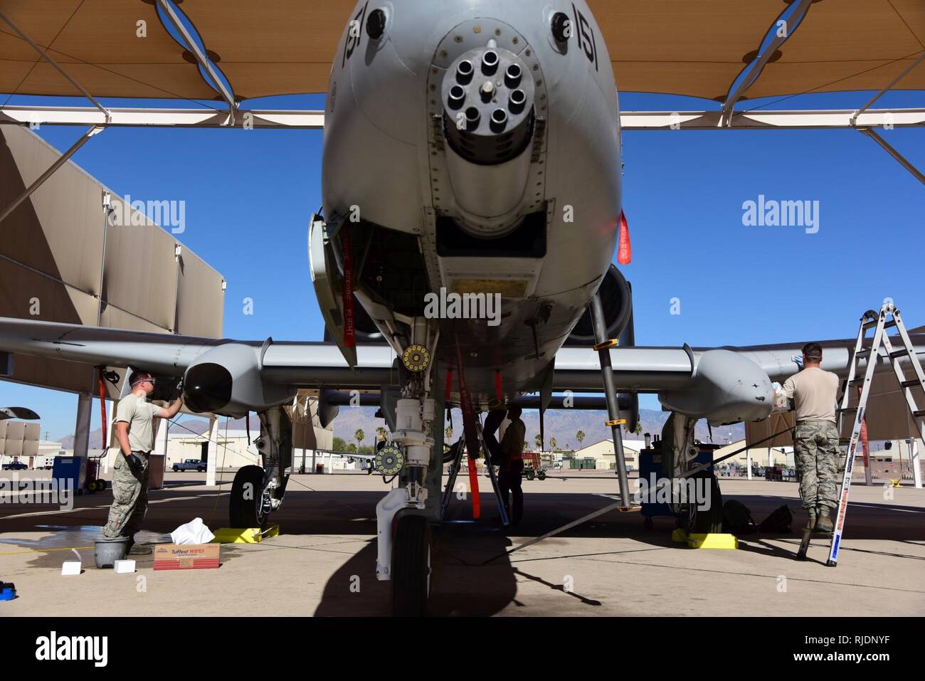 The A-10C Thunderbolt II Demonstration Team cleans and maintains an A-10 at Davis-Monthan Air Force Base, Ariz., Jan. 23, 2018. The A-10 Demo Team and A-10 Heritage Flight pilots are scheduled to support a Heritage Flight flyover during the opening ceremonies of Super Bowl LII in Minneapolis, Minnesota. Stock Photo