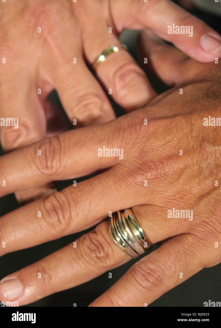 Close uop of Hands with engagement rings of young Couple, USA Stock Photo