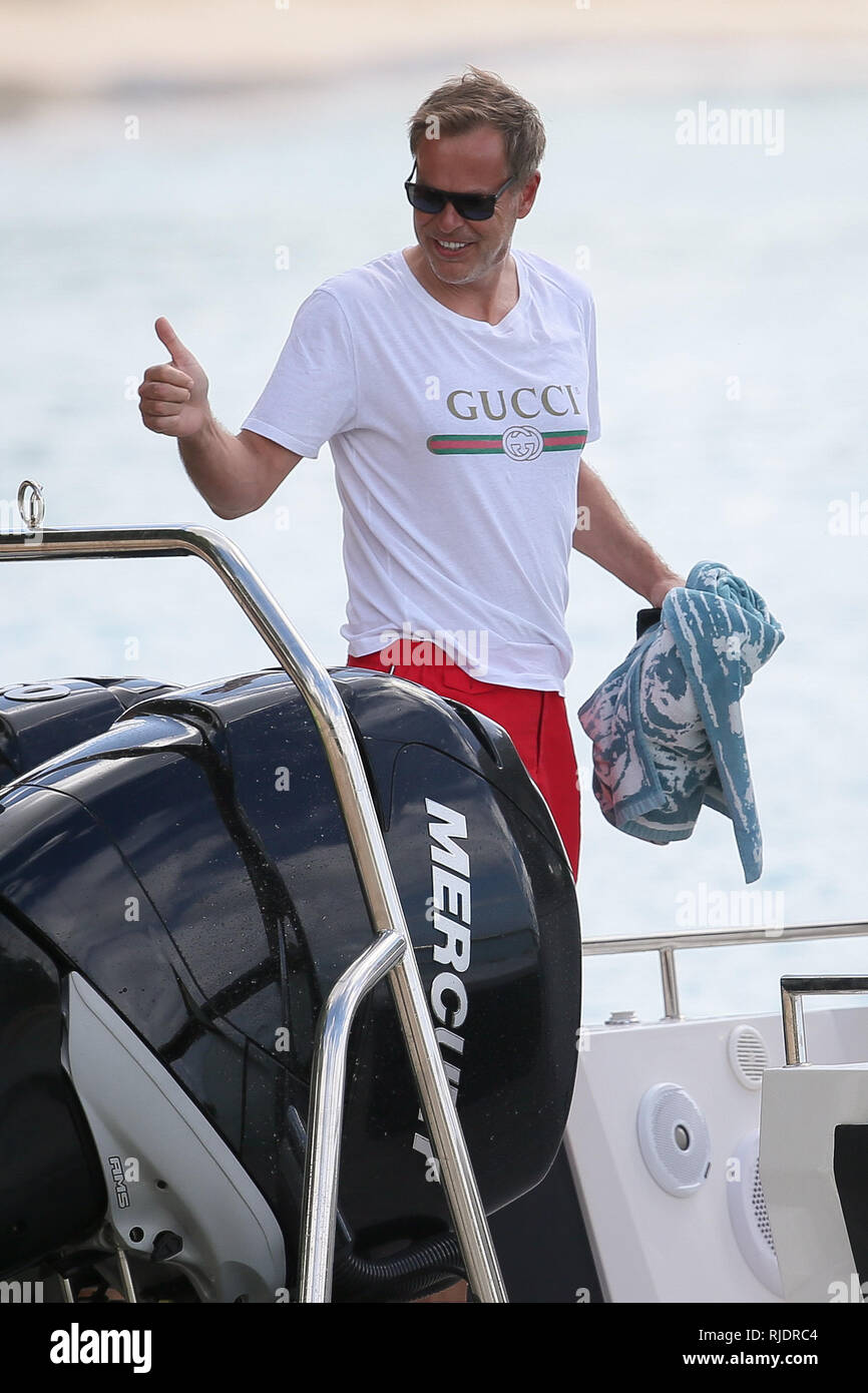Dragon's Den star Peter Jones seen getting onto a boat with his wife Tara Capp and friends.  Featuring: Peter Jones Where: Barbados, Barbados When: 05 Jan 2019 Credit: WENN.com Stock Photo