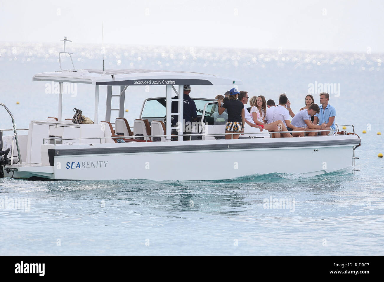 Dragon's Den star Peter Jones seen getting onto a boat with his wife Tara Capp and friends.  Featuring: Peter Jones, Tara Capp Where: Barbados, Barbados When: 05 Jan 2019 Credit: WENN.com Stock Photo