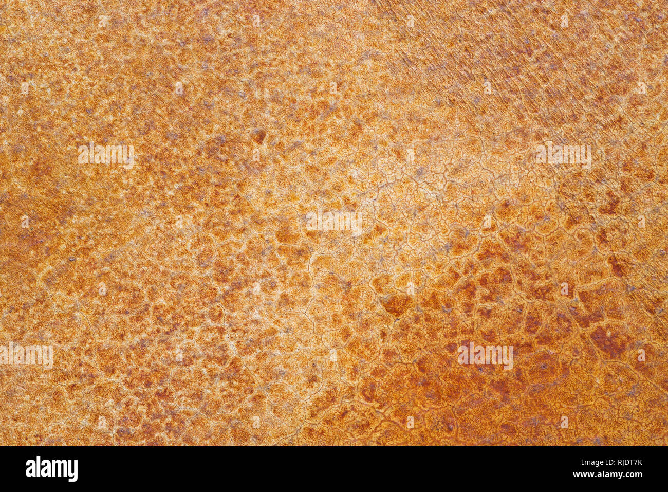 finished stained orange concrete with fine crack structure background texture Stock Photo