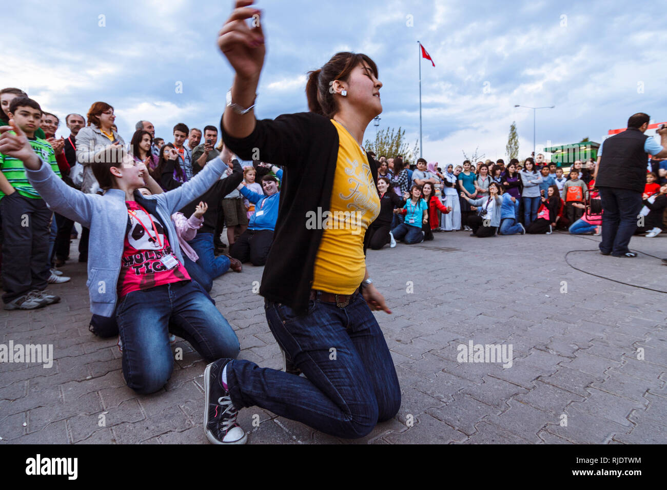 Goreme, Nevsehir Province, Turkey : Young Turkish women dance in circles at the town square of Goreme in the Cappadocia historical region. Stock Photo