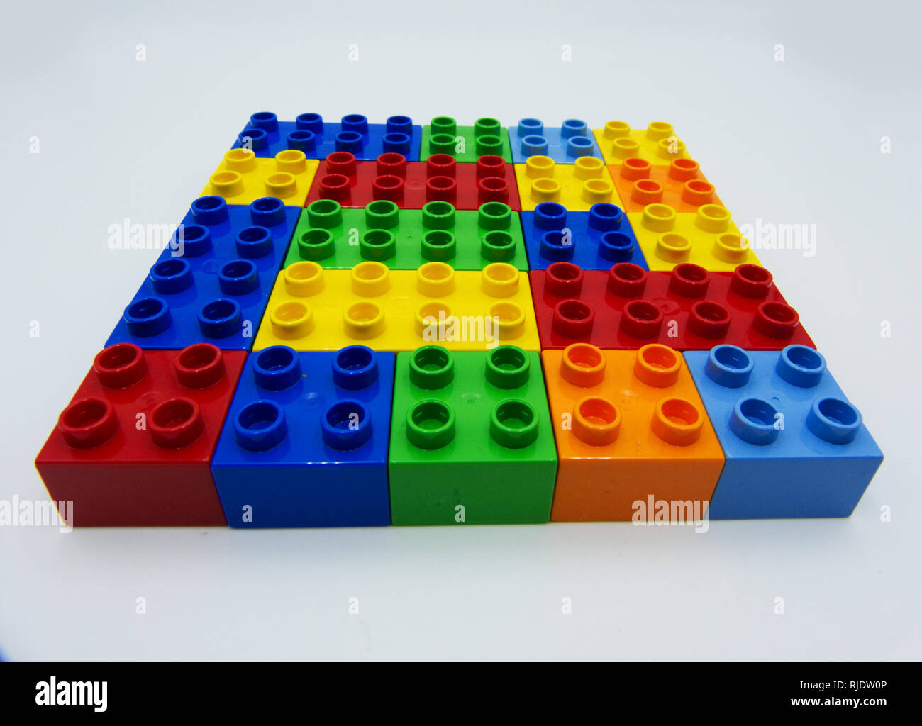 Plastic building blocks on white background Stock Photo Alamy