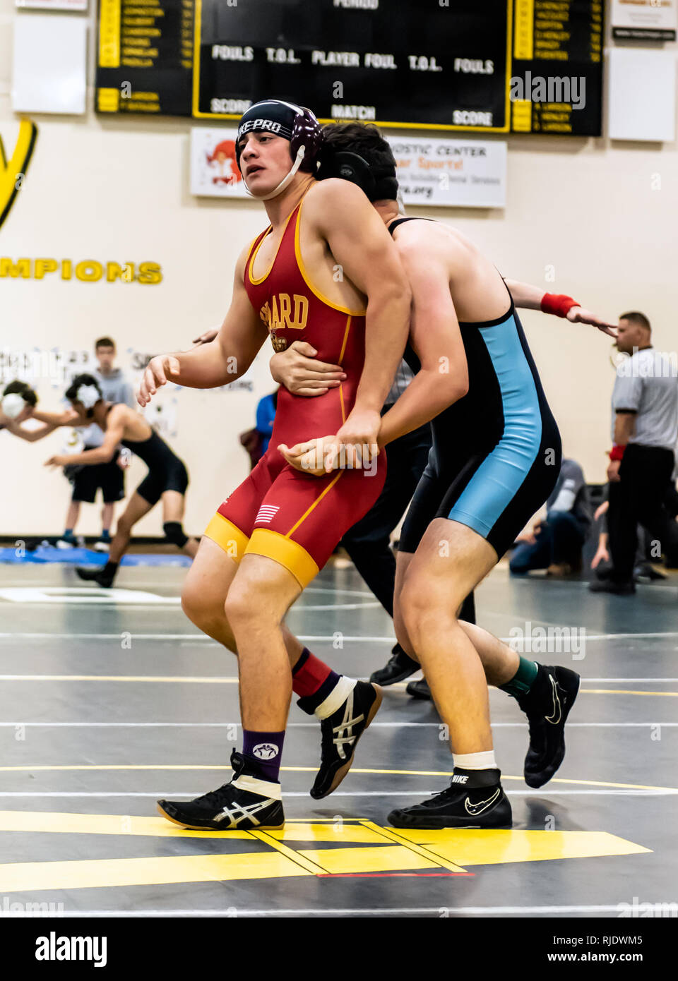Wrestler from Oxnard High School attempting to break grip of Buena athlete during tournament at Ventura High School in California USA on February 2, 2 Stock Photo