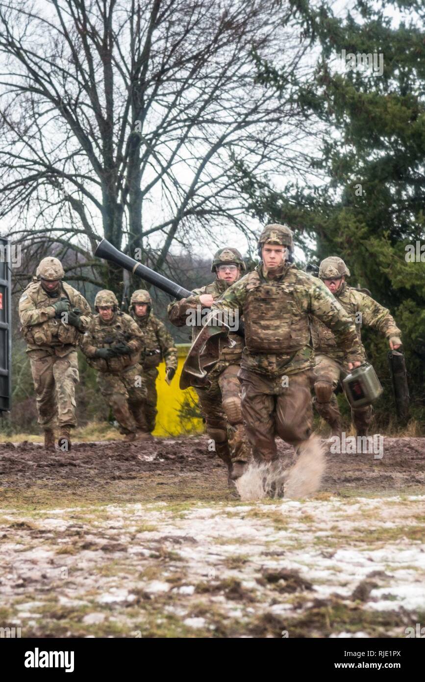 U.S. Soldiers assigned to Headquarters and Headquarters Company, 1st Battalion, 503rd Infantry Regiment, 173rd Infantry Brigade Combat Team (Airborne), fire the M252A1 81mm Mortar System at Mortar Firing Point 1 in the Baumholder Military Training Area, Germany, Jan. 18, 2018. The training provided the Mortarmen the opportunity to increase their proficiency and familiarization with the weapon system. The 173rd Airborne Brigade is the U.S. Army’s Contingency Response Force in Europe, providing rapidly deploying forces to the U.S. Army Europe, Africa and Central Command Areas' of Responsibility  Stock Photo