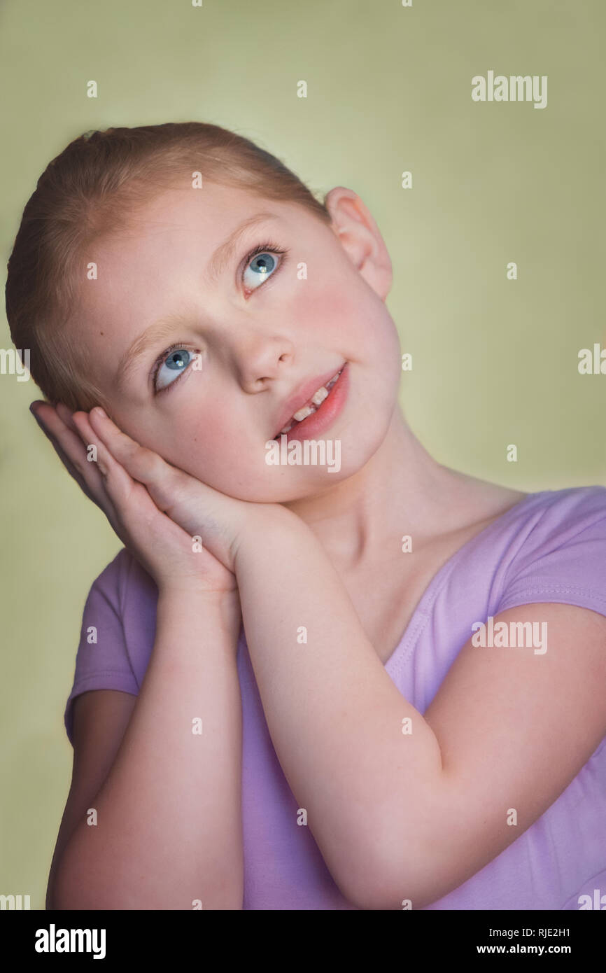 Beautiful young girl day dreaming Stock Photo