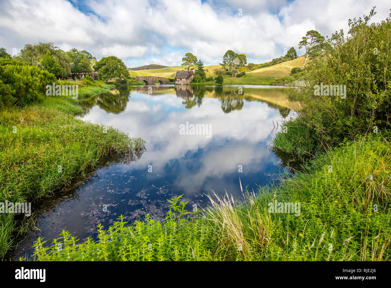 MataMata, New Zealand -  March 2017 Hobbit house mirroring in the lake Stock Photo