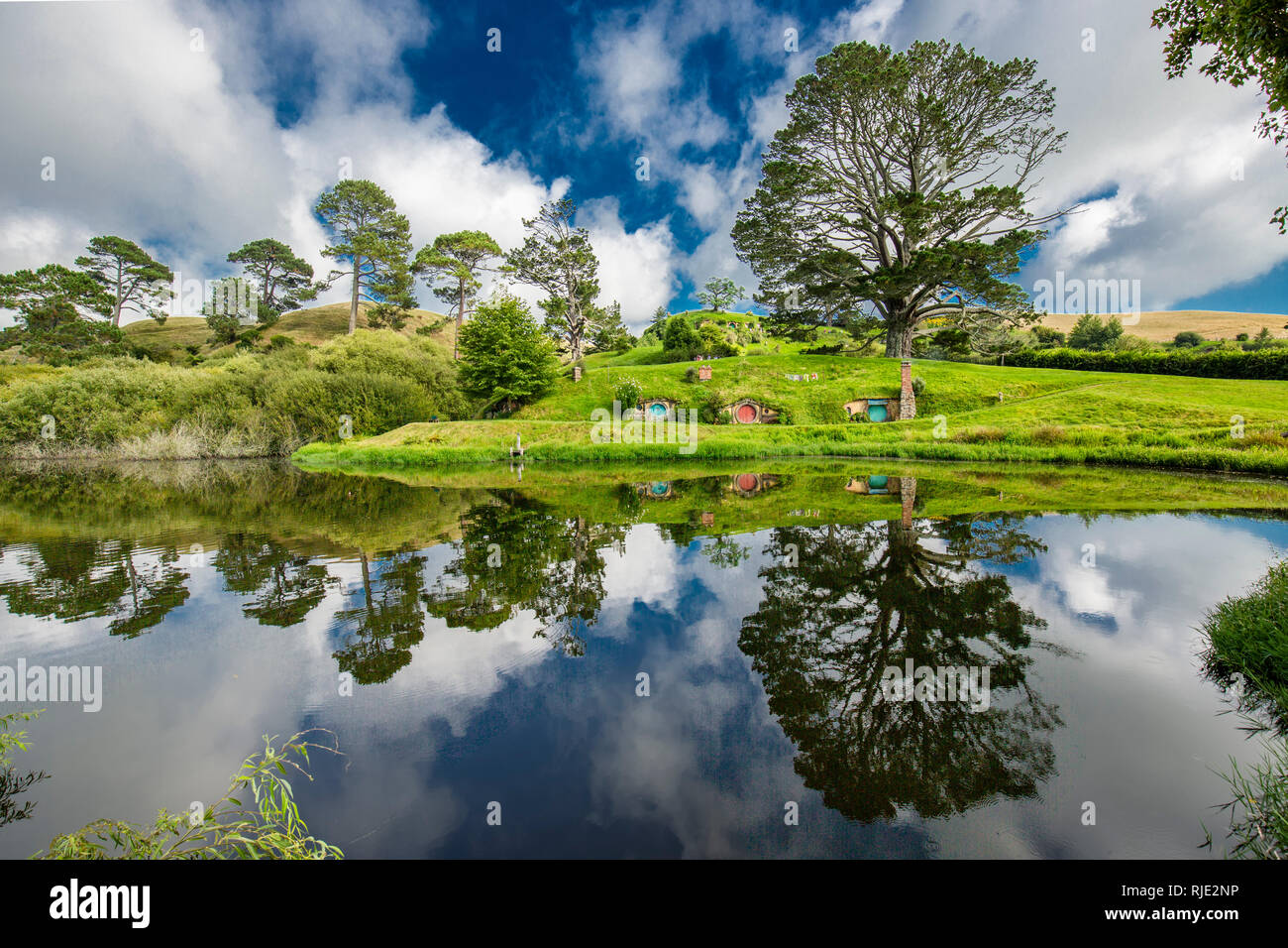 MataMata, New Zealand -  March 2017 Hobbit house mirroring in the lake Stock Photo