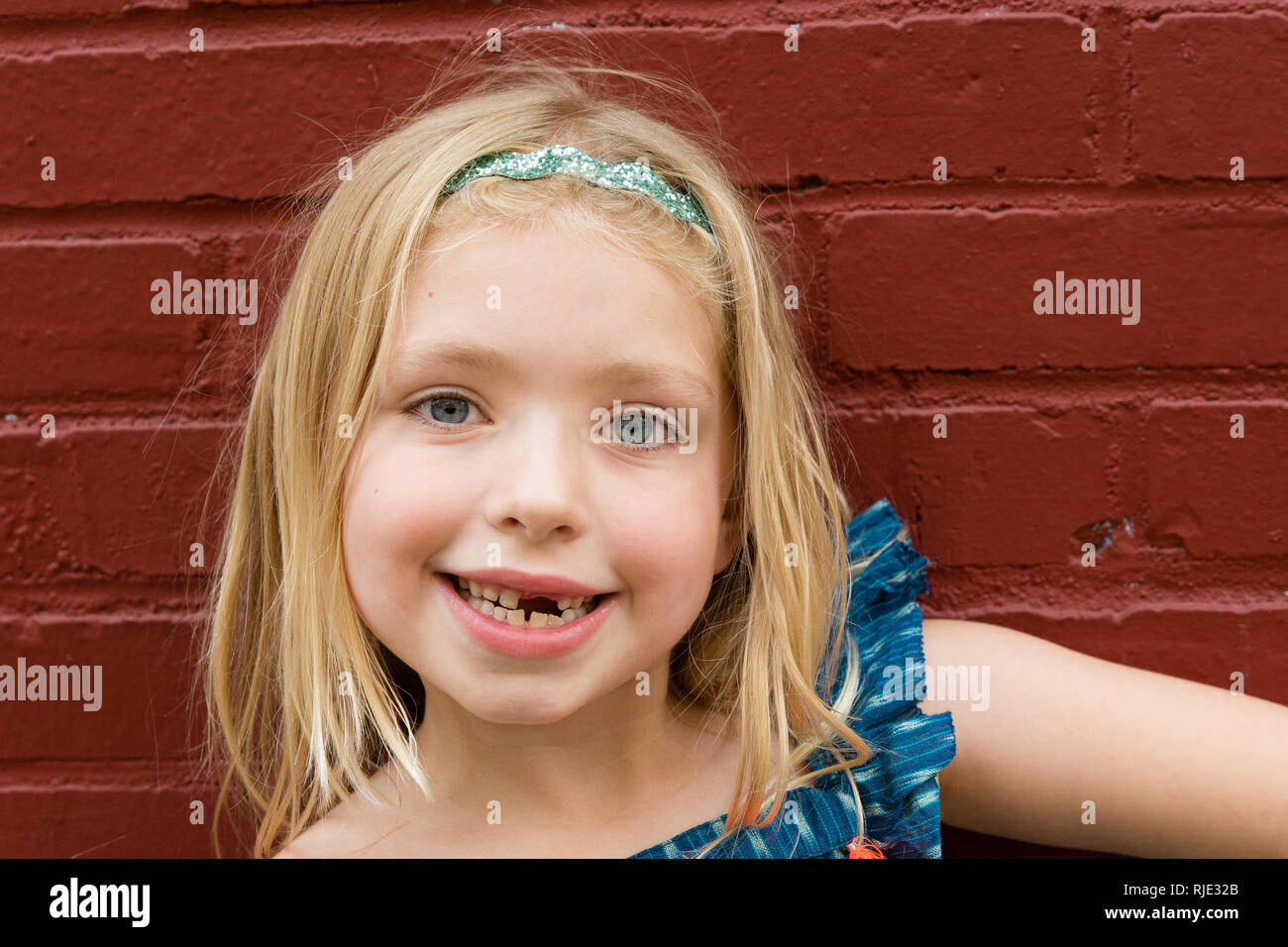 Young school age girl missing front tooth Stock Photo