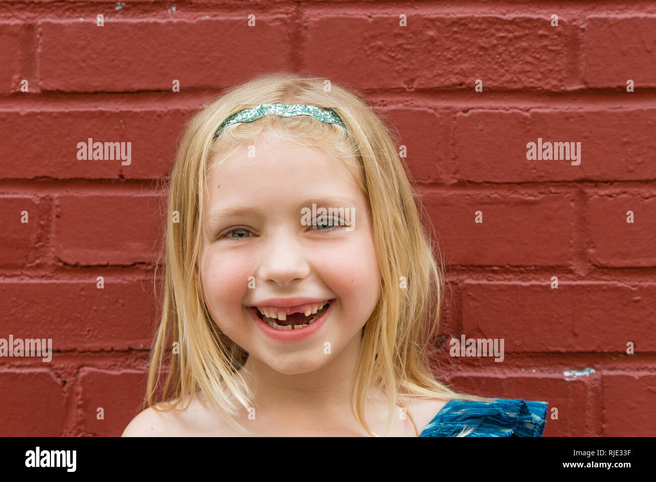 Young school age girl missing front tooth Stock Photo