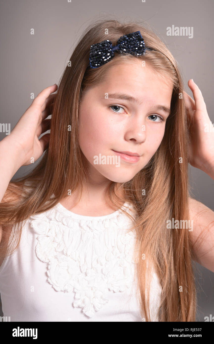 Portrait of beautiful young girl posing on background Stock Photo - Alamy