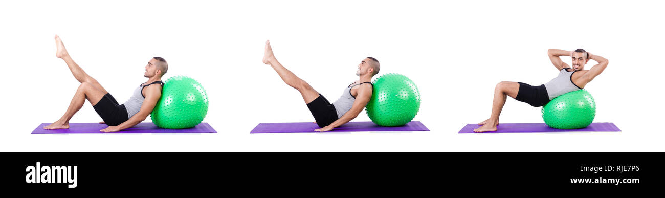 Man with swiss ball doing exercises on white Stock Photo - Alamy