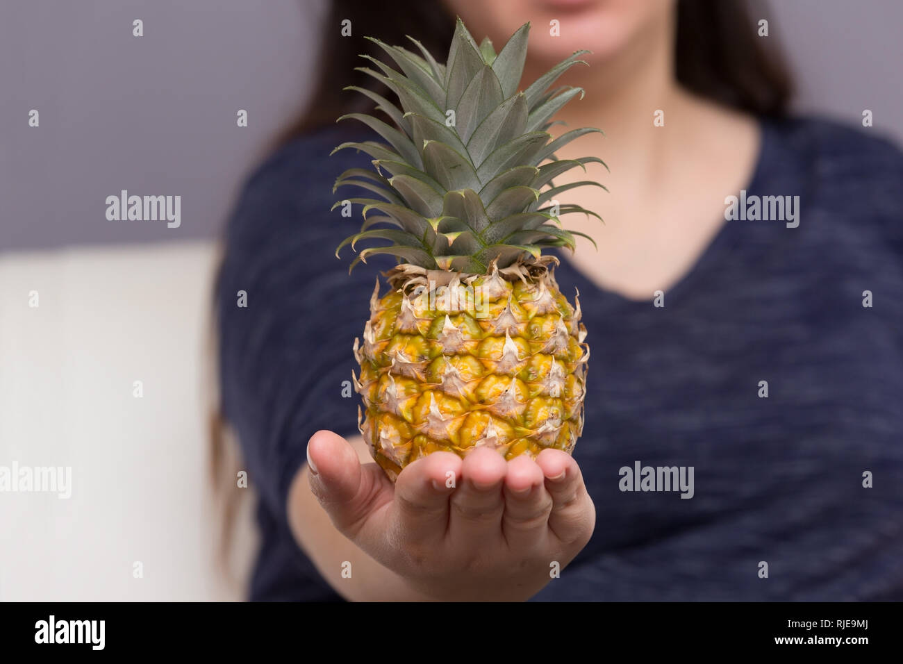 Woman Holding Organic Healthy Pineapple Fruit Stock Photo