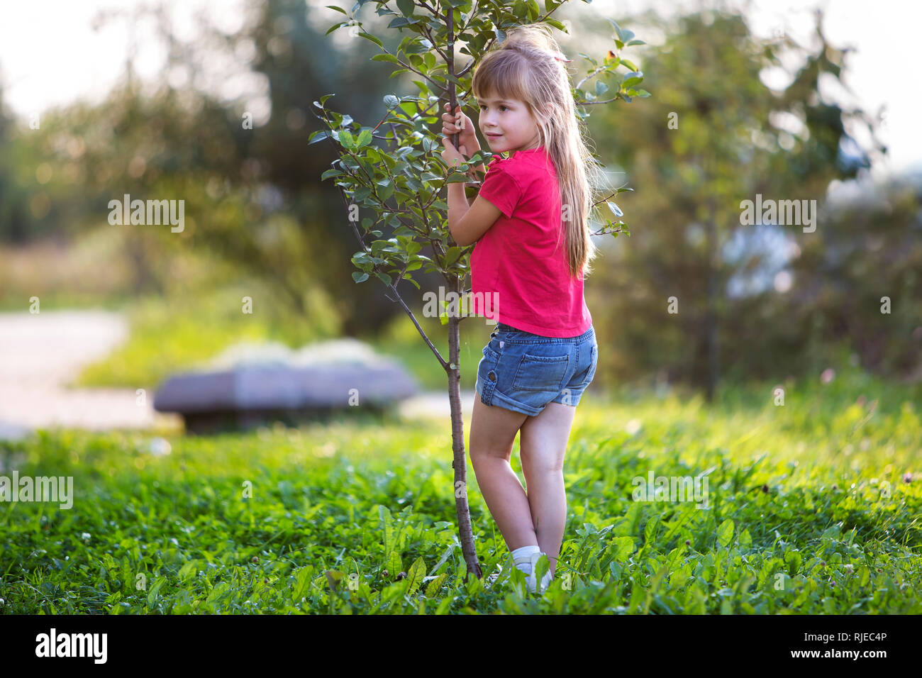 Cute pretty smiling child girl with gray eyes and long blond hair in ...