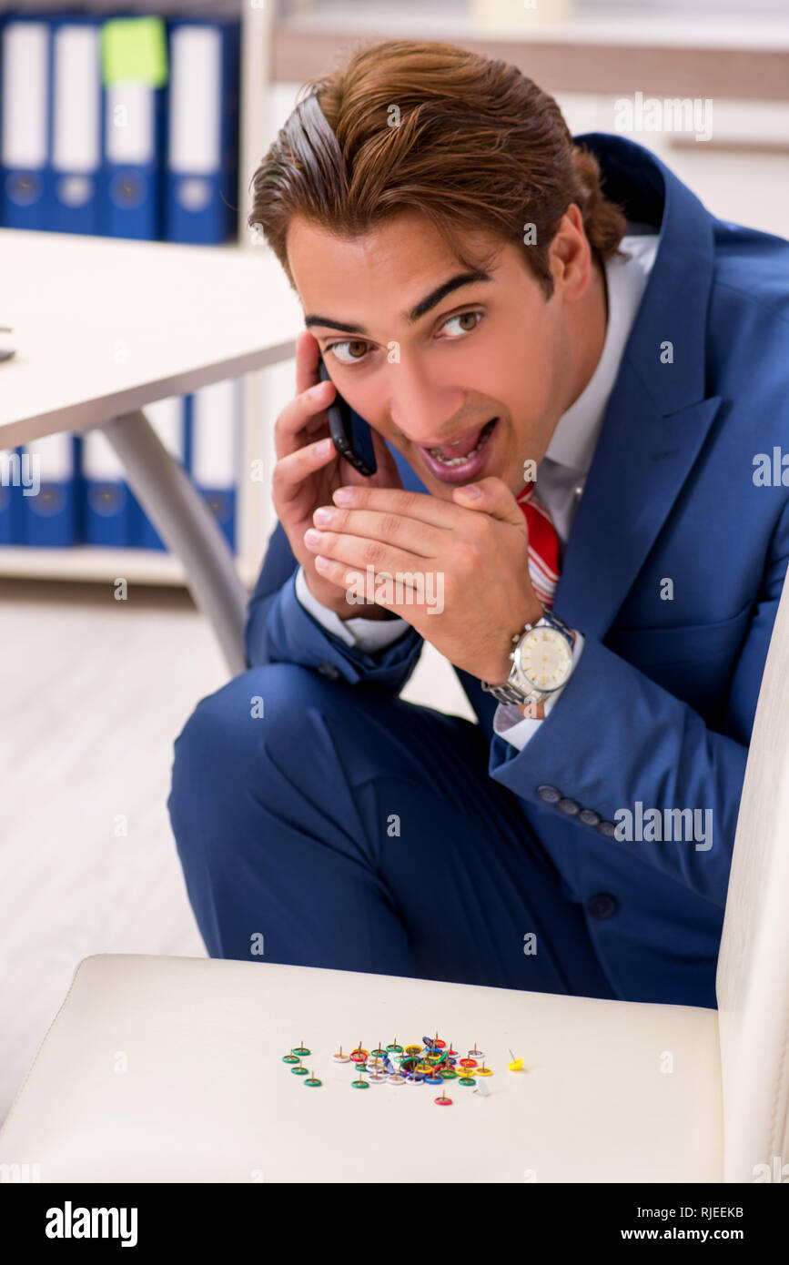 Office prank with sharp thumbtacks on chair Stock Photo Alamy