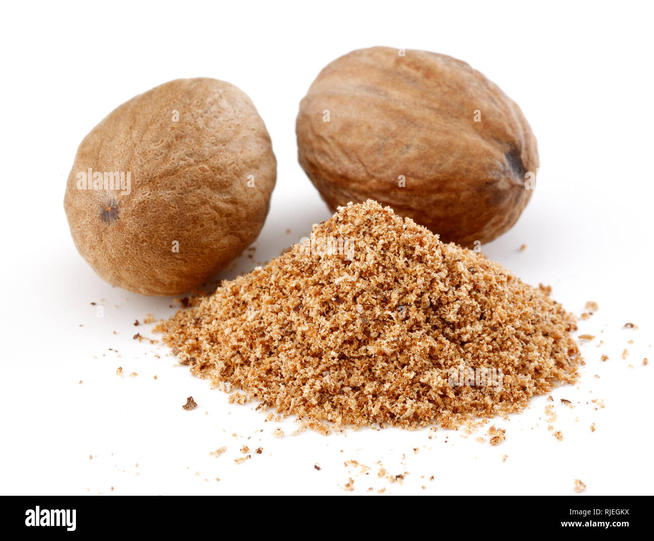 Whole and grated nutmeg isolated on white background Stock Photo Alamy