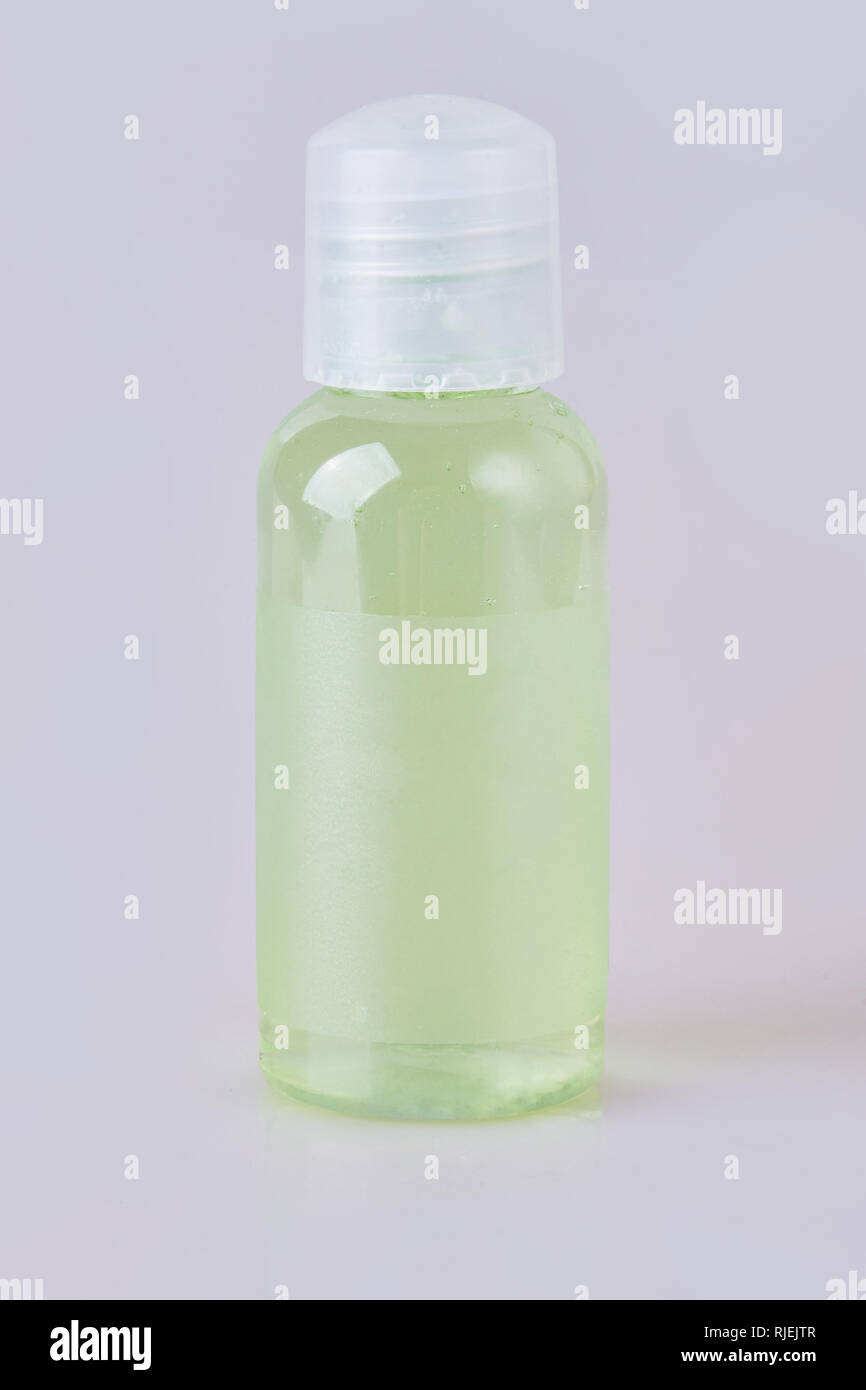 Hotel green bathroom shampoo, shower gel, lotion in a small transparent