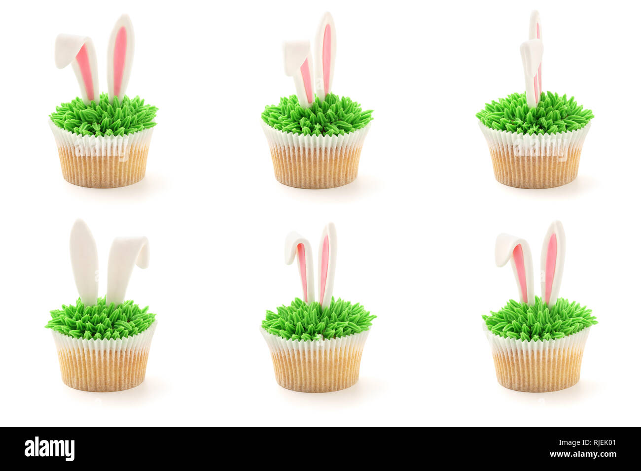 Easter bunny ears cupcakes shot from different angles. Isolated on white. Stock Photo