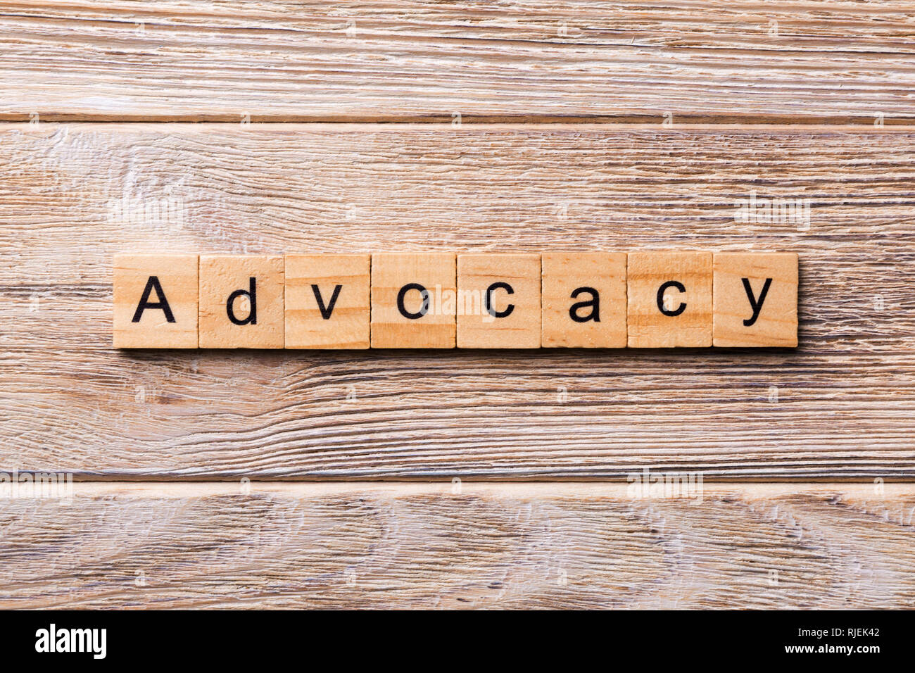 ADVOCACY Word Written On Wood Block ADVOCACY Text On Wooden Table For 