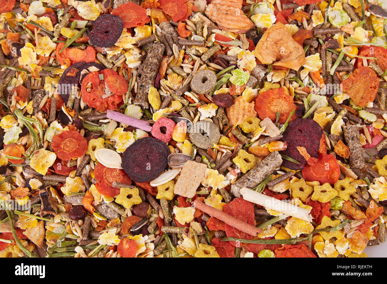 Food for rodents. Healthy food background (texture). Food of dry compound for hamsters, rats, chinchillas, mice, squirrels consisting of grain protein Stock Photo