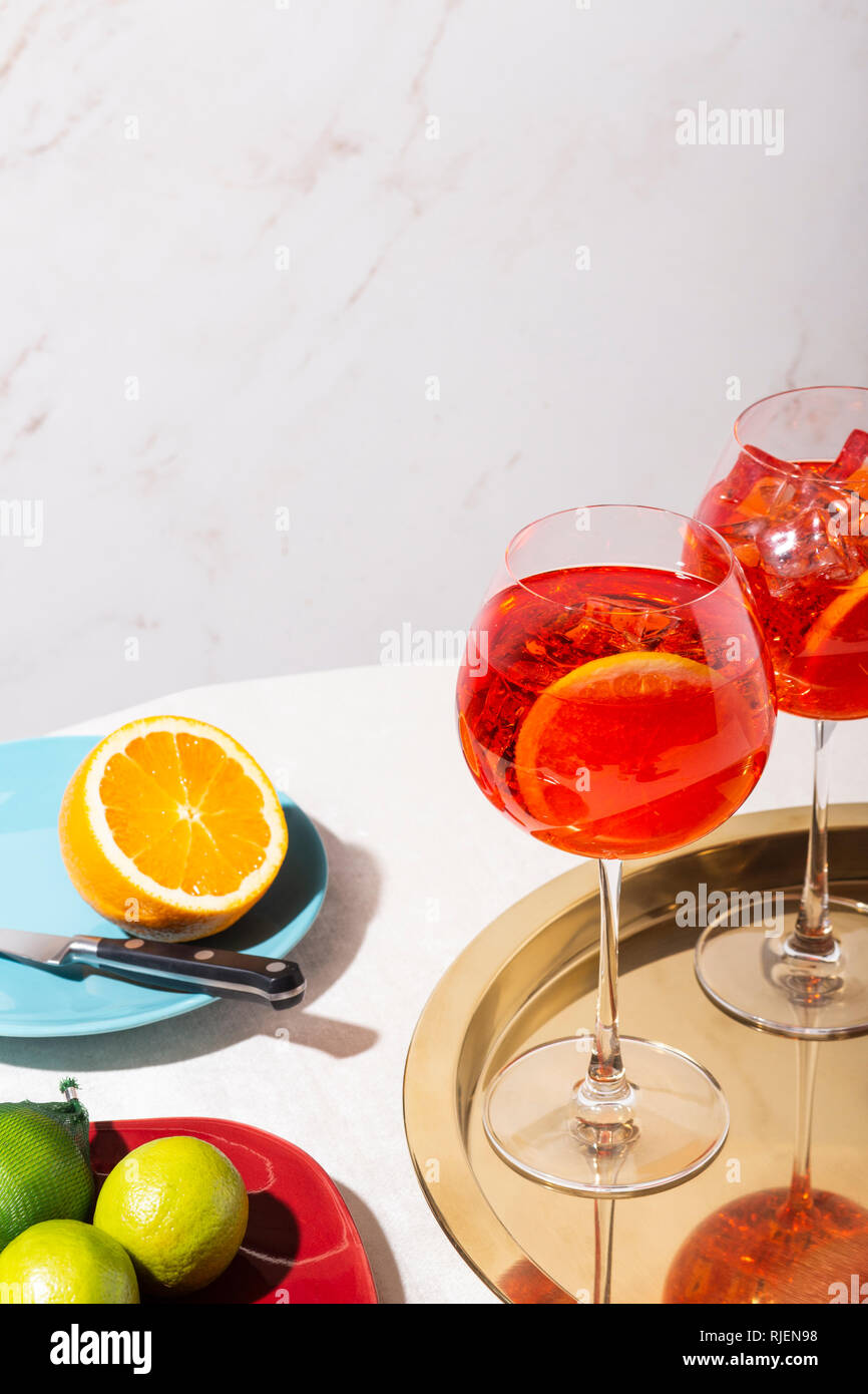 Spritz veneziano, an IBA cocktail, with Prosecco or white sparkling wine, bitter, soda, ice and a slice of orange, in a calix on a table, pop graphic Stock Photo