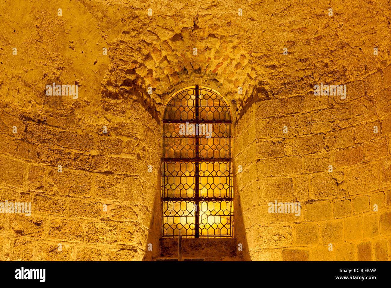 Window on the corridor wall inside Mont Saint-Michel abbey, Normandy coast, France Stock Photo