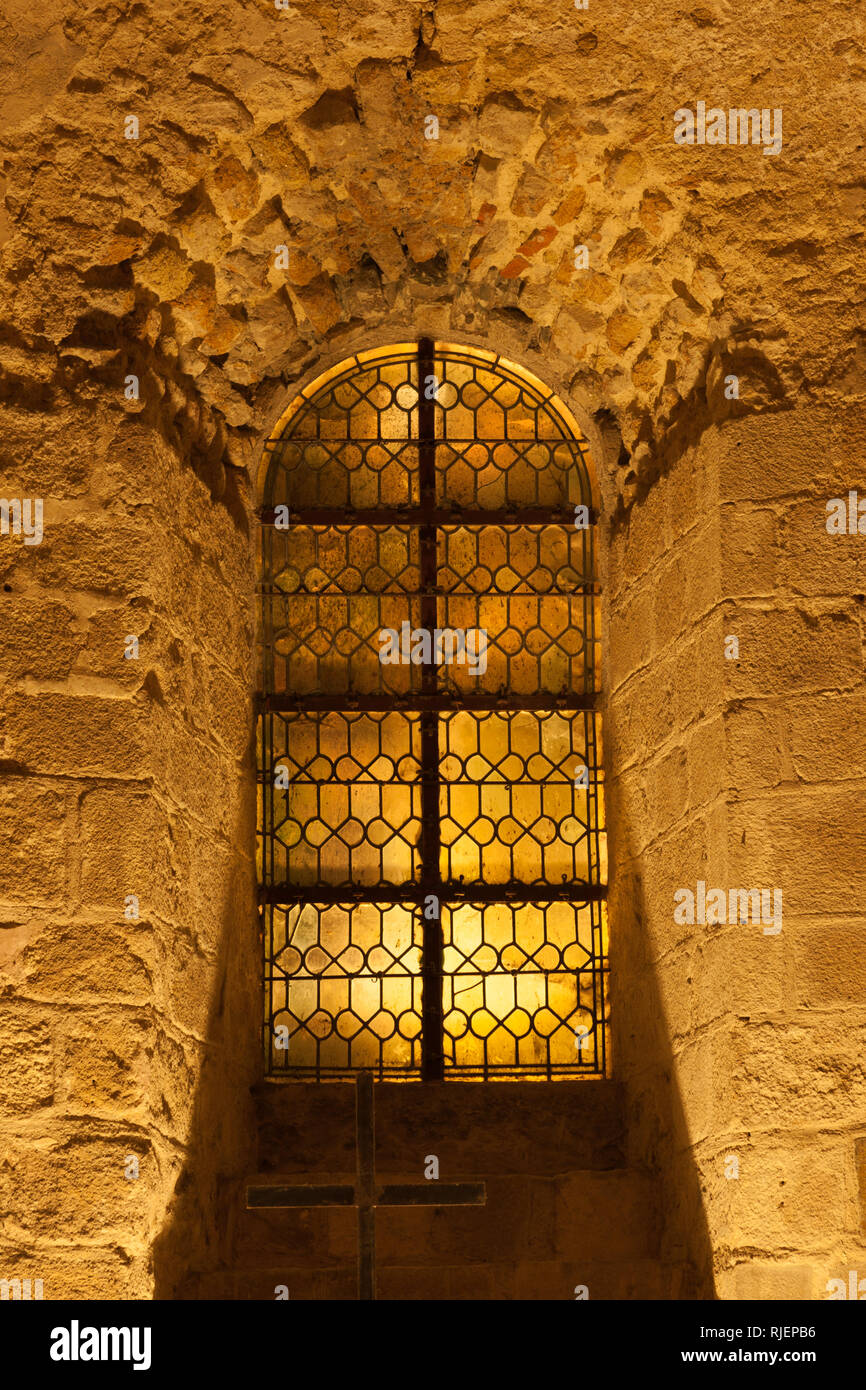 Window on the corridor wall inside Mont Saint-Michel abbey, Normandy coast, France Stock Photo