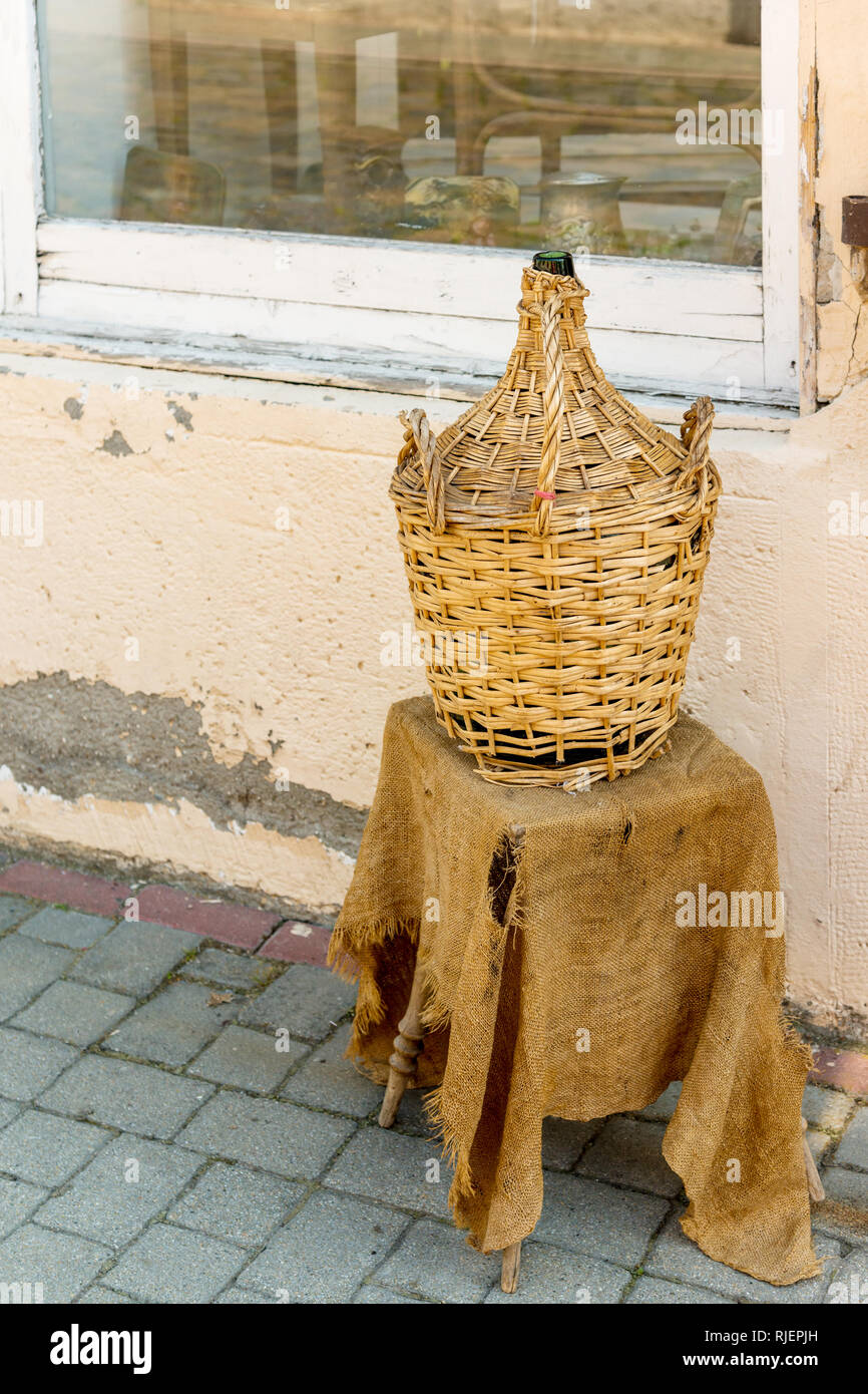 Wine bottle (carboy) by the shop  in Tokaj town center, Tokaj wine region, Hungary Stock Photo