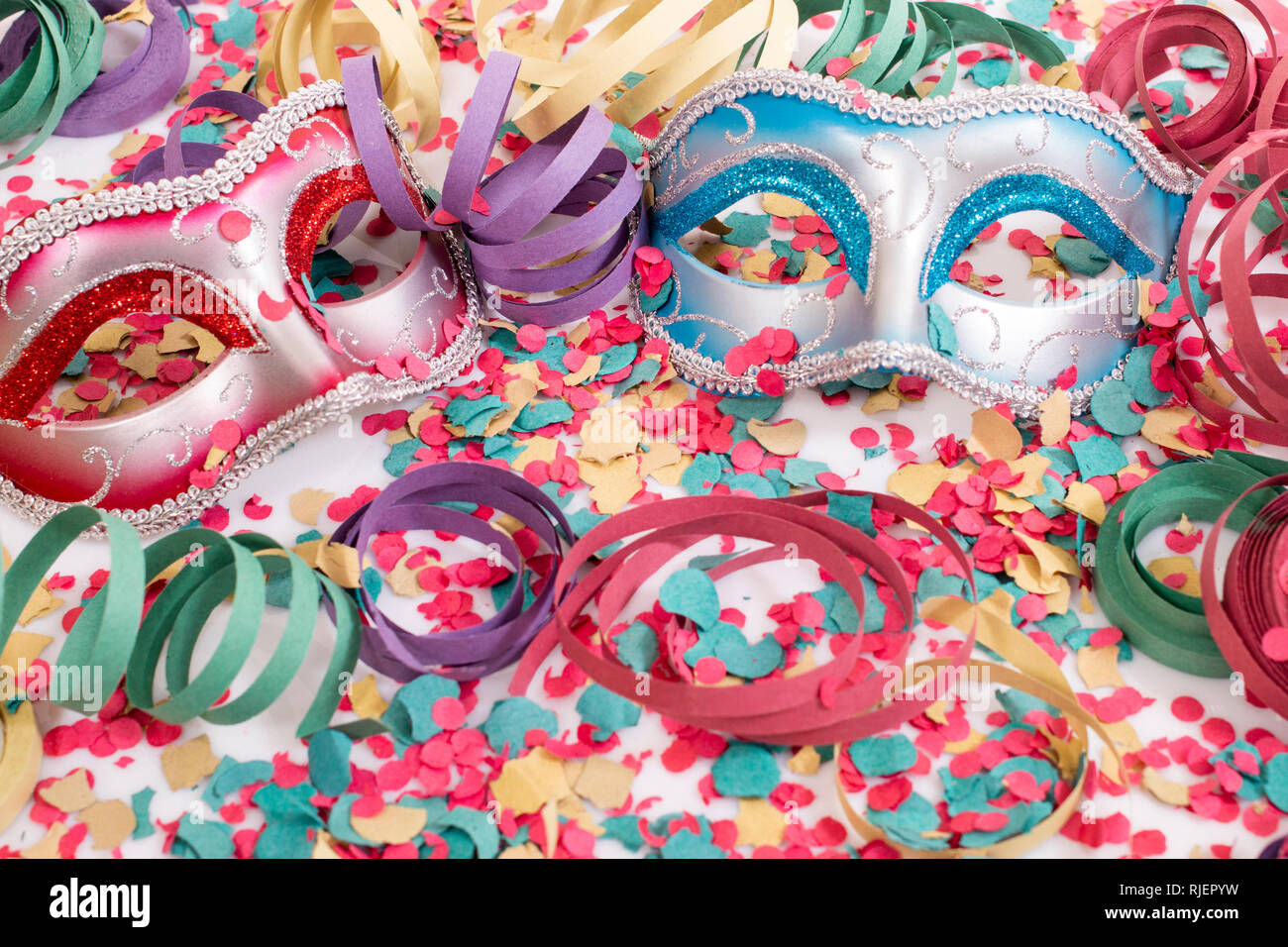 carnival masks with confetti and serpentine streamers Stock