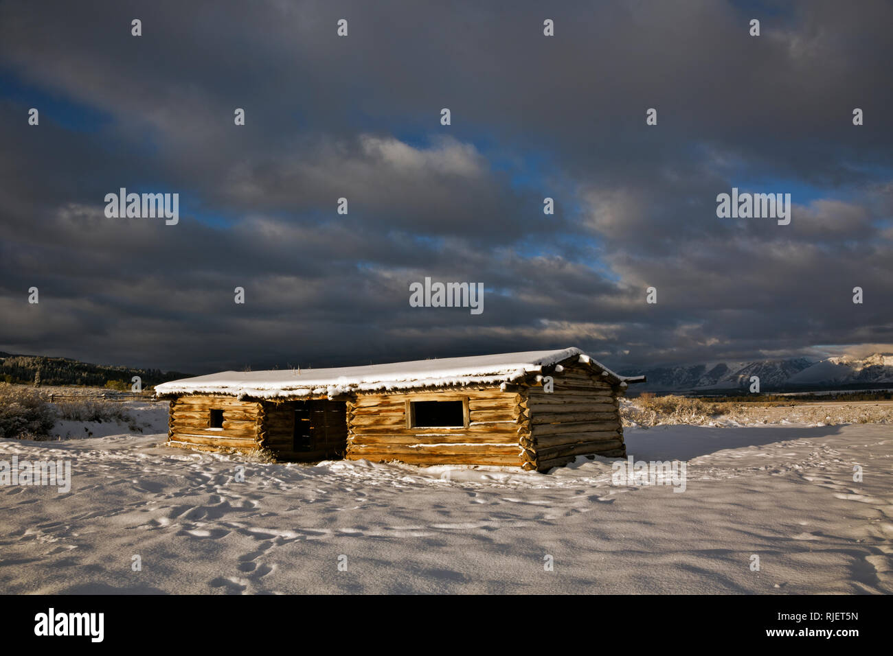 WY03212-00...WYOMING - A stormy morning sunrise at Cunningham Cabin Historic Site In Grand Teton National Park. Stock Photo