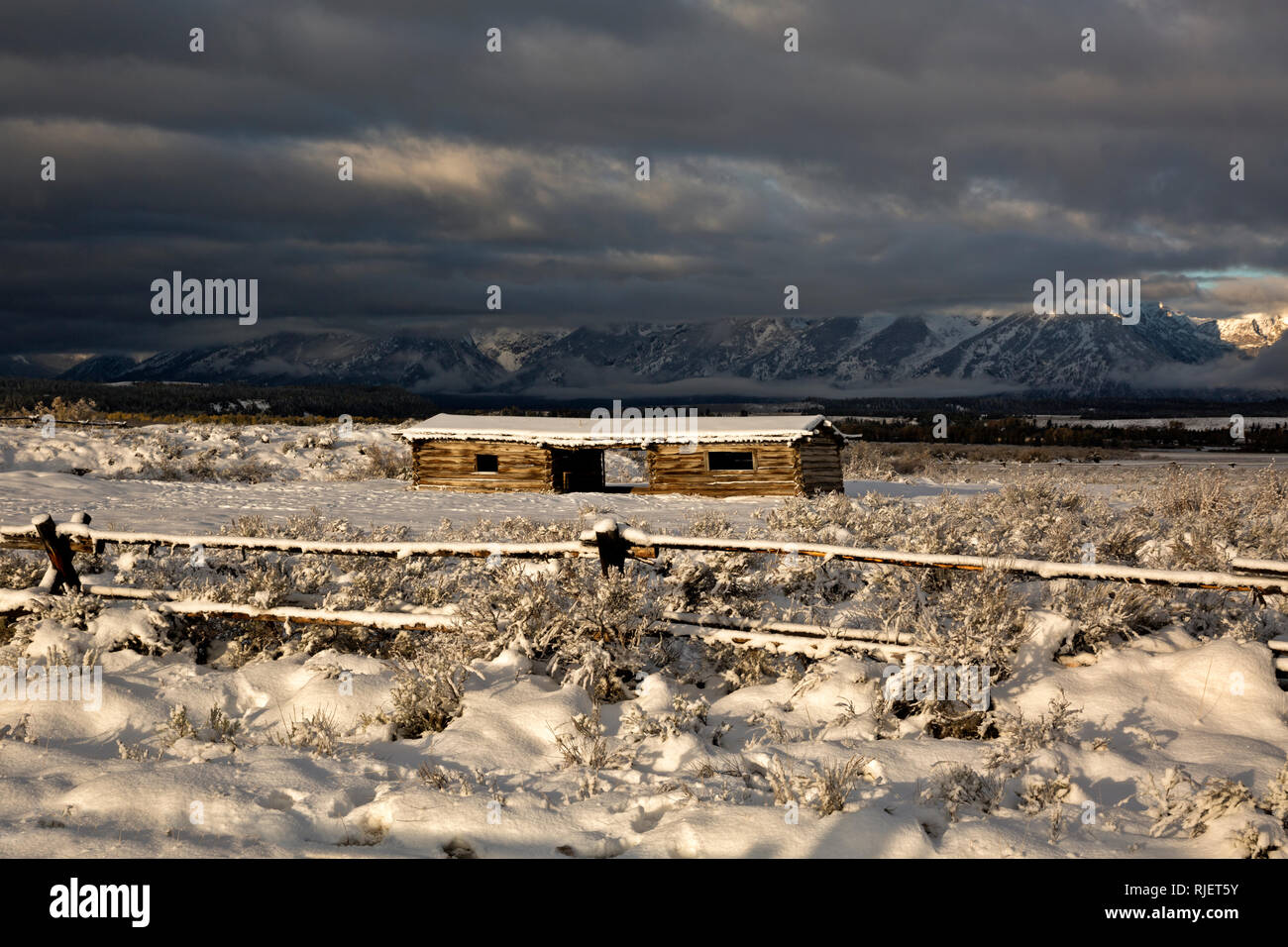 WY03213-00...WYOMING - A stormy morning sunrise at Cunningham Cabin Historic Site In Grand Teton National Park. Stock Photo