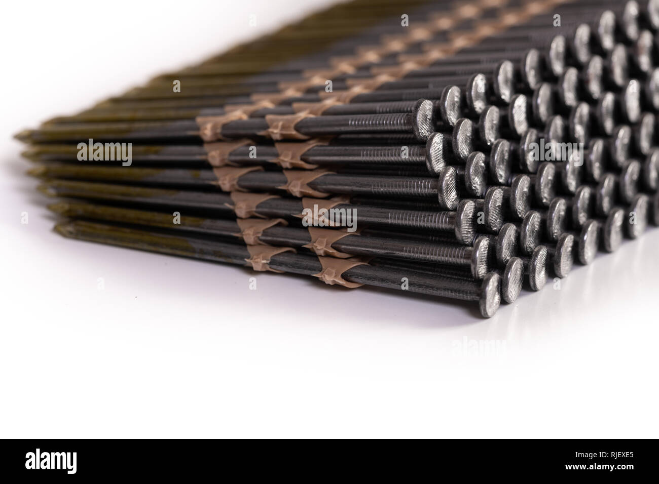 Nail gun nails used in a framing nail gun isolated on a white