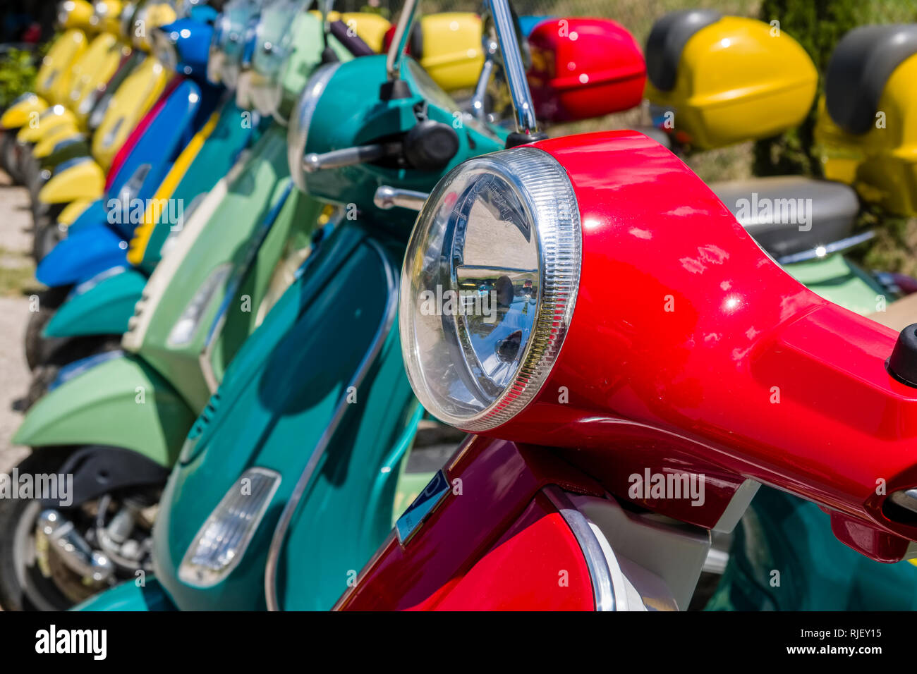 Colorful Vespa scooters in a row Stock Photo Alamy
