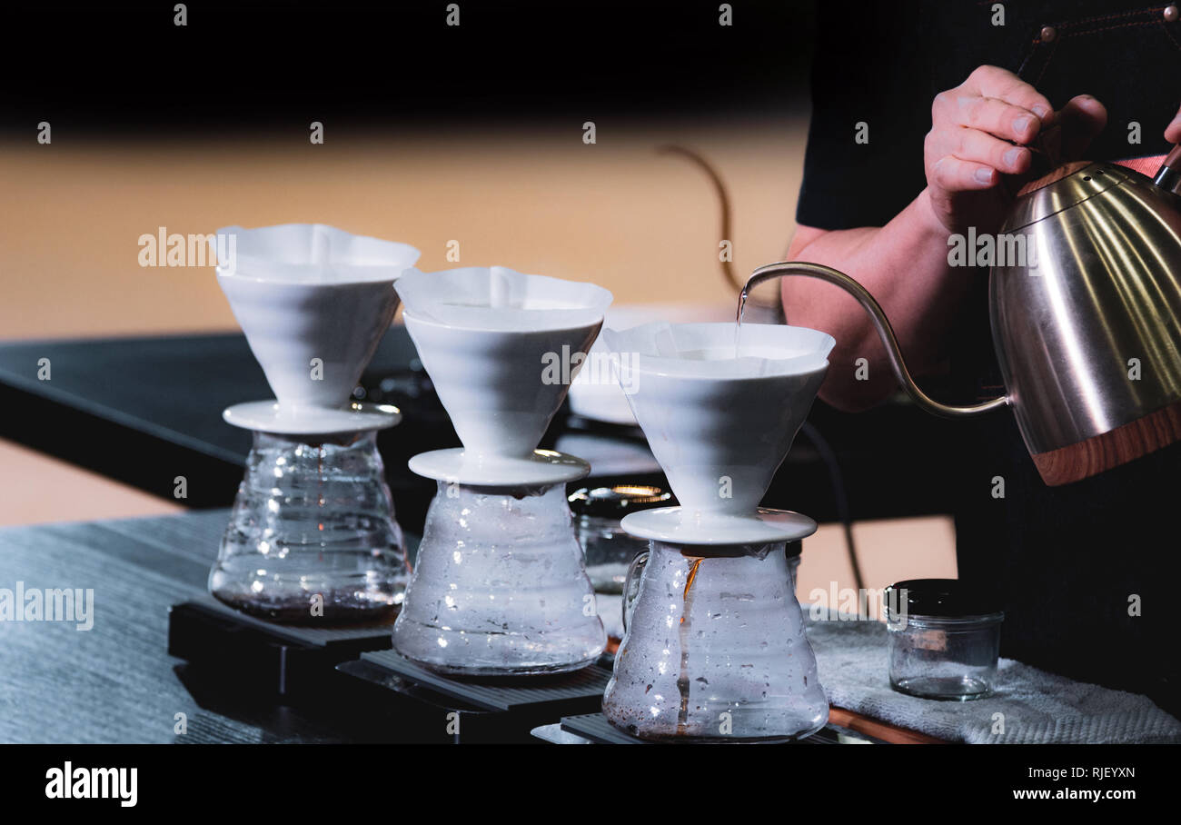 https://c8.alamy.com/comp/RJEYXN/barista-is-making-coffee-coffee-preparing-with-chemex-chemex-dripping-hot-fresh-coffee-RJEYXN.jpg