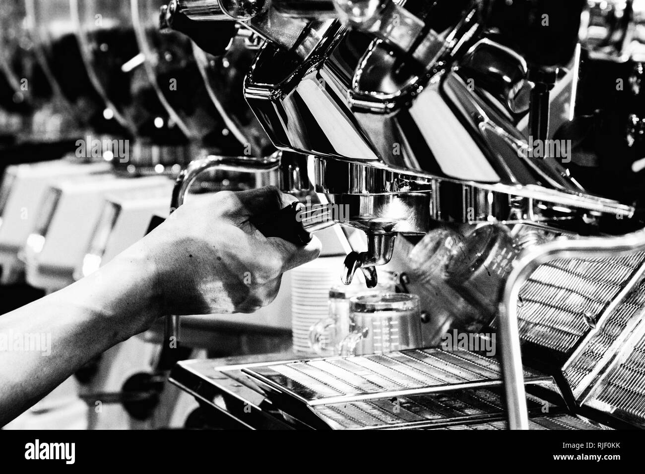 Espresso shot from coffee machine in coffee shop,Coffee maker in coffee shop Stock Photo