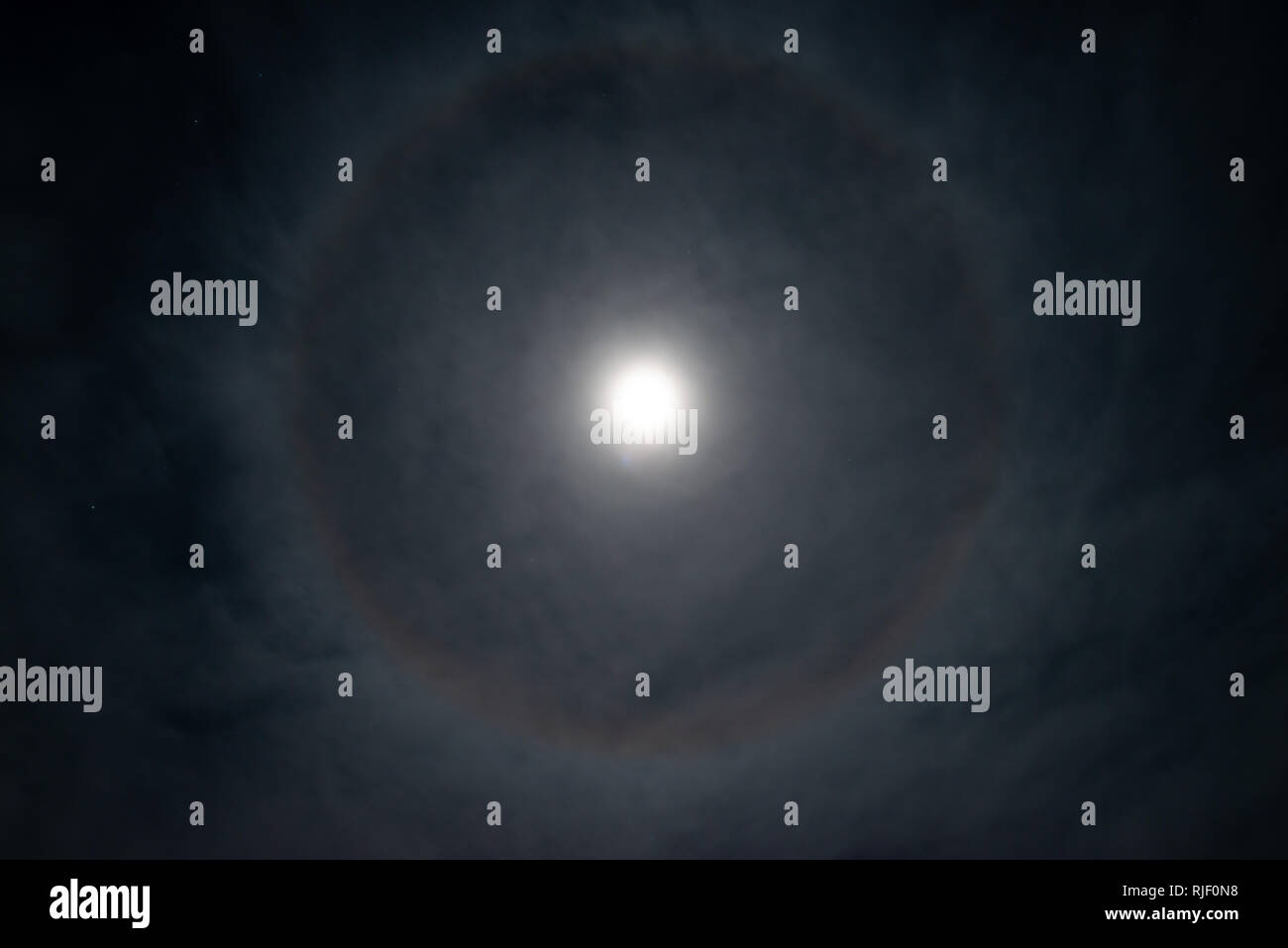 full moon with ring shaped halo at a cloudy sky Stock Photo - Alamy