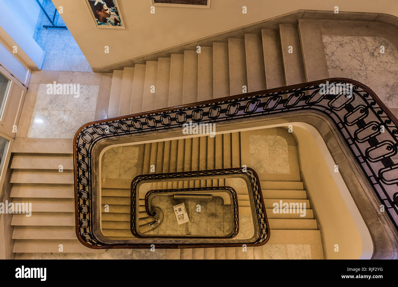 Brussels, Belgium - 02 02 2019:  Spiral staircase of the Brussels Parliament durig a local touristical visit Stock Photo