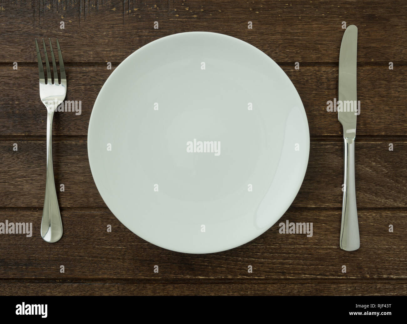 plate set on dining table Stock Photo