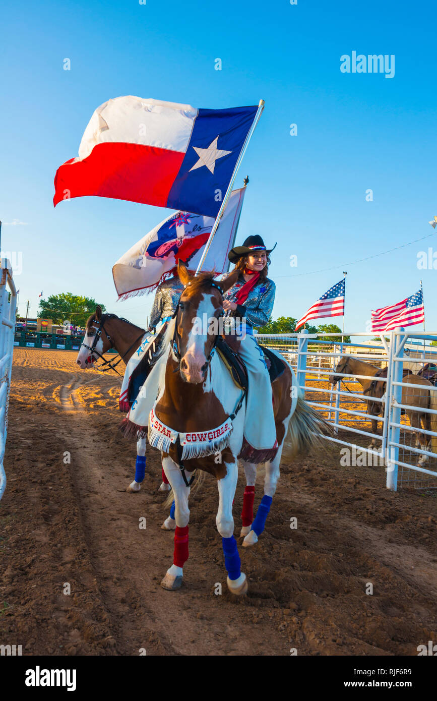 Rodeo entertainment The Lone Star Cowgirls showing pride and patriotism Stock Photo